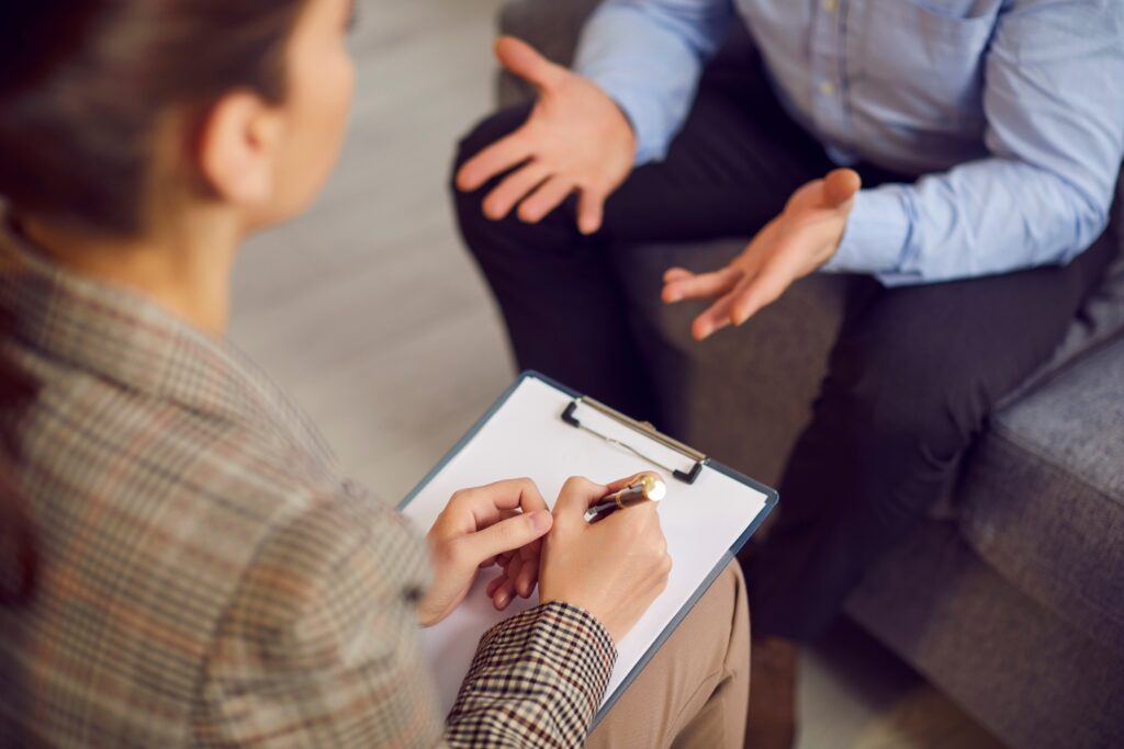 Psychologist talking and consulting with a patient