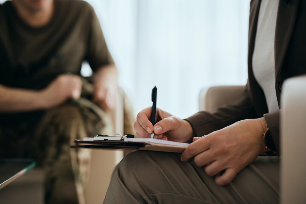Therapist taking notes during a session